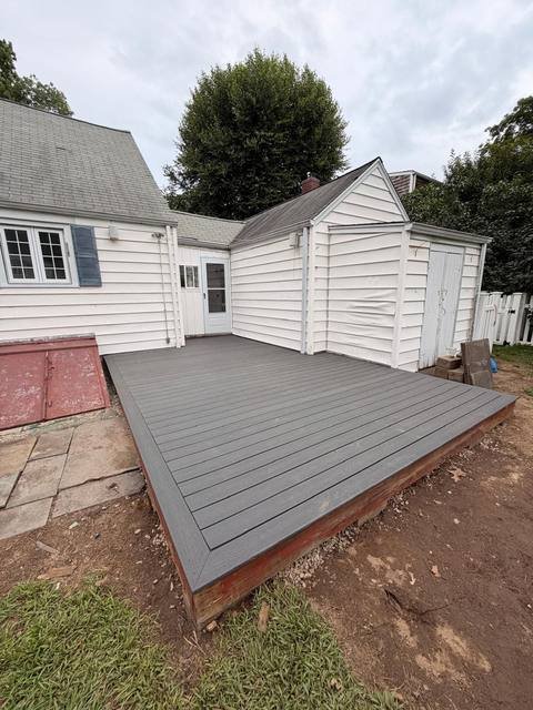 Finished composite deck attached to the back of a house