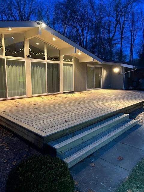 Built-in composite deck bench along the house wall