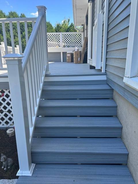 Finished wood deck lit up at dusk