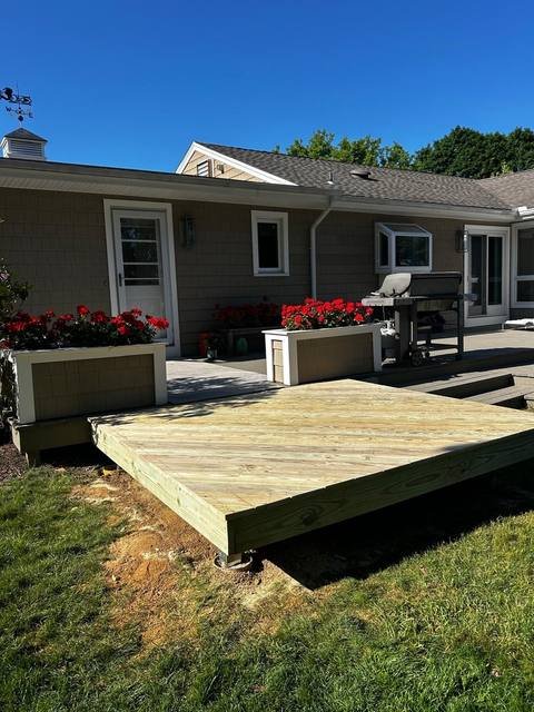 Composite front porch deck with white railings