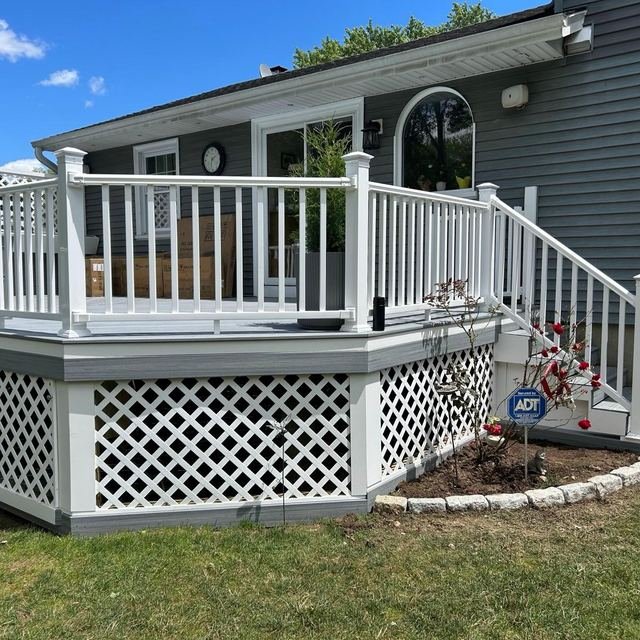 White guardrail and railing installation on a deck